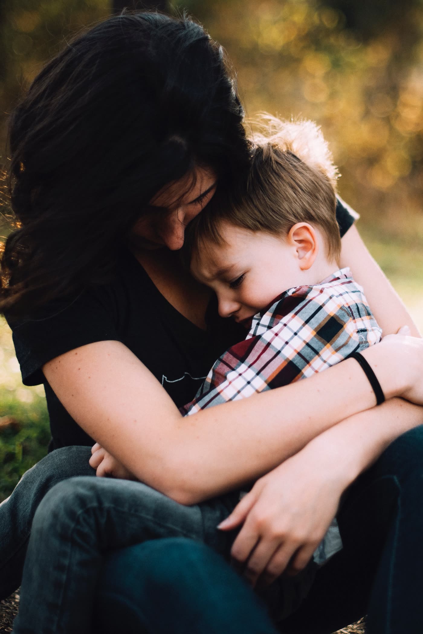 Parent comforting a child during a difficult time